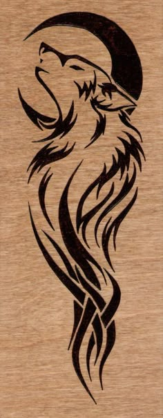 a wooden plaque with an image of a wolf's head on it, in black ink