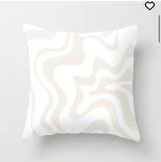 a white pillow with wavy lines on it