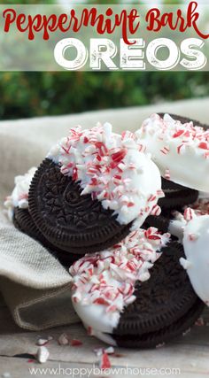 peppermint bark oreos with white frosting and sprinkles on top