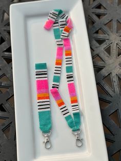 two colorful lanyards on a white plate