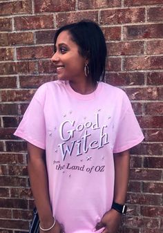 Wizard of Oz Womens Pink Good Witch Short Sleeve T Shirt Good Witch, New York City Fc, Jersey Hat, Nba Hats, Vancouver Whitecaps Fc, Sporting Kansas City, Wizard Of Oz, Short Sleeve T Shirt, Pink Shorts