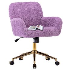 a purple chair sitting on top of a wooden desk