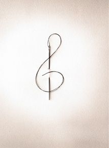 a musical note is hanging on the wall