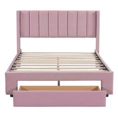 a pink bed frame with two drawers underneath the headboard and foot board, in front of a white background