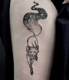 a woman's thigh with a tattoo on it and an image of a fox