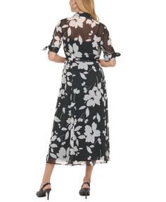 Bring on the blooms in Calvin Klein's midi shirtdress. Formal Floral Print Shirt Dress For Summer, Spring Evening Shirt Dress With Short Sleeves, Black A-line Shirt Dress For Spring, Elegant Fitted Floral Print Shirt Dress, Calvin Klein Midi Length Dresses For Daywear, Elegant Black Short Sleeve Shirt Dress, Spring Black Formal Shirt Dress, Elegant Calvin Klein Midi Dress For Daywear, Elegant Black Shirt Dress For Spring