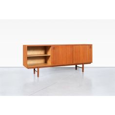 the sideboard is made out of wood and has two open shelves on each side