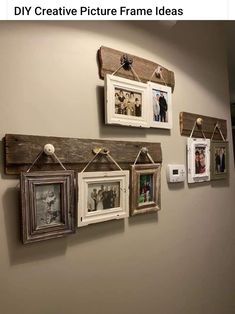 some pictures hanging on a wall with clothes pins