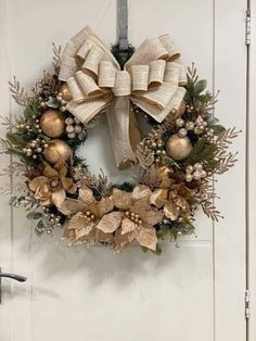 a christmas wreath hanging on the front door