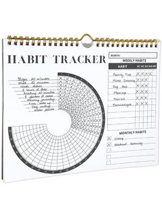 a spiral notebook with the words habit tracker written on it and an image of a pie chart