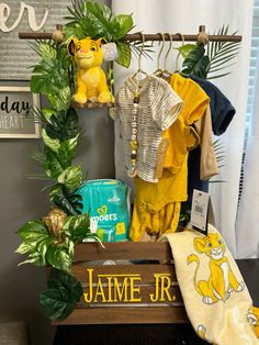 a shelf with clothes and other items on it in front of a window, next to a sign that says james jr