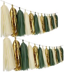 green and white tassels hanging on clothes line with gold foiled ones in the background