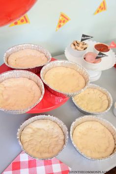 some pies sitting on top of a table with red and white checkered napkins