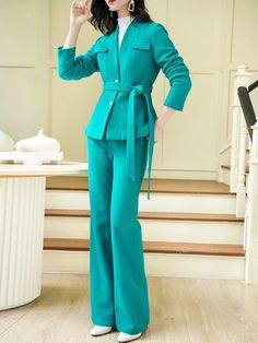 The perfect workwear outfit, this pantsuit is stylish and functional, featuring an elegant blazer with two buttons and matching pants that will take you from the office to the weekend in refined style. Blazer: Collarless, chest faux flap pockets, lined Blazer: Front button closure with a belt, long sleeves Pants: Flare bottom, full length Pants: Zip fly with hook-and-bar closure 50% wool, 50% polyester Dry Clean Item #3519 Women's blazer & pants two-piece pantsuit set SIZE INFO XS=US2=UK6=EU32 S Elegant Green Outerwear For Work, Elegant Green Outerwear For Office, Elegant Green Office Outerwear, Aqua Outfit, Flare Pants Set, Collarless Blazer, Full Length Pants, Elegant Blazers, Style Blazer