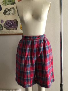 Vintage high rise plaid shorts, good condition, women's size 12 runs smaller. Shown here on a women's size 4 mannequin. Please use measurements for reference as vintage sizes vary. Measurements laying flat, not doubled 13.75 inch waist (also has elastic on the back of waistband) 21 inches in length All sales final, thanks for looking :) Plaid Bottoms With Built-in Shorts, Plaid High-waisted Cotton Shorts, High-waisted Plaid Bottoms With Built-in Shorts, High Waist Plaid Cotton Shorts, Plaid High Waist Cotton Shorts, Vintage Plaid Bottoms For Summer, Vintage Plaid Summer Bottoms, Vintage High Waist Plaid Bottoms, Plaid Bottoms With Built-in Shorts For Spring