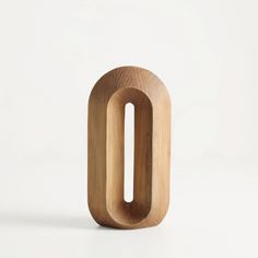 a wooden object that looks like the letter o