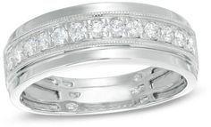 a white gold wedding ring set with princess cut cubics and channeled diamond accents