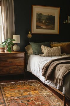 a bed sitting next to a window with a rug on the floor in front of it