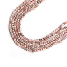 three strands of pink and brown beads