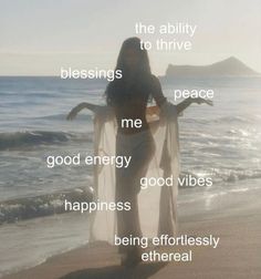 a woman standing on top of a beach next to the ocean with words above her