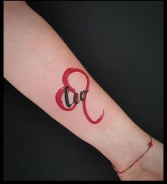 a woman's arm with a tattoo on it and the word love written in cursive font