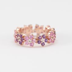 Pink sapphire ring 14k Gold Floral Wedding Band For Women, Unique Pink Flower Diamond Anniversary ring, Natural Gemstone Eternity Ring   ✥  Details ✥  - Stone: Gemstone / Moissanite/ Diamond/ CVD (Can Be Customize) - Metal Type: (White gold/ Yellow gold/ Rose gold, Sterling silver)  - Band Width: Approx. 5 MM - Cut: Round Cut - Clarity: VVS*  Ask For Quote if Required Real Diamond Ring   ✥ C U S T O M I Z A T I O N ✥  > The gemstone ring can be made of Morganite, Moissanite, Aquamarine, Emerald, Amethyst Wedding Band, Floral Wedding Bands, Amethyst Wedding, Real Diamond Rings, Antique Engagement Ring, Pink Sapphire Ring, Diamond Free, Eternity Wedding Band, Eternity Band