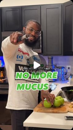 a man cutting green apples on top of a wooden cutting board in a kitchen with the words, no more mucus