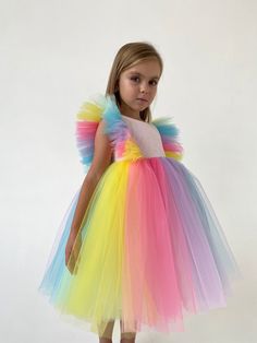 Exclusive and very cute cupcake girl dress perfect for any occasion: birthday, 1st communion, wedding. Your girl will look like an absolute princess and will get a lot of compliments. Very comfortable and easy to wear for long hours and doesn't restrict movements. Out cute model wear size 5 and her measurements are (bust 57, waist 54, height 110). The top is pink, boat neckline, cup sleeves; zip at the back. It has a fluffy riffle skirt in pink, blue, purple, yellow, mint colors with ruffles and unicorn effect, below the knee. The lining is 100% cotton for safety and comfortable fit. *Please note that colors may slightly vary depending on your monitor settings. You can find more gorgeous girl dresses in my Sweet Princess Dress shop by following this link: https://www.etsy.com/shop/SweetPri Pink Boat, Flower Girl Dress Tulle, Communion Wedding, Birthday 1st, Tulle Tutu Dress, Cup Sleeves, Dress Tutu, Flower Girl Dresses Tutu, 1st Communion