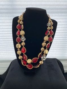 Beautiful vintage necklace is 22 inches long with double strands having glittering red glass and gold-tone balls and chain.  The necklace comes with a bonus bracelet.  The ensemble is perfect as a gift, holiday jewelry, formal wear or adding elegance to a day outfit. Holiday Party Beaded Jewelry, Gold Beaded Necklaces For Evening Costume Jewelry, Gold Beaded Necklace Costume Jewelry For Evening, Gold Costume Jewelry Beaded Necklace For Evening, Elegant Gold Jewelry For Holidays, Elegant Gold Jewelry For Holiday, Gold Beaded Necklace For Evening In Costume Jewelry Style, Formal Red Beaded Necklace, Elegant Holiday Gold Jewelry