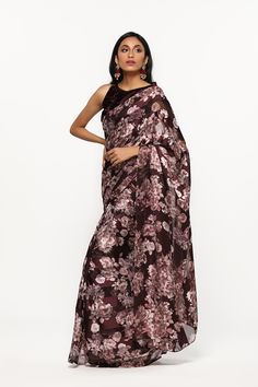 Get an elegent evening look with this plum floral printed satin saree, featuring a halter neck velvet blouse. . . . . . . #diyaonline #diyaskin #sarees #saree #fashionwear #punjabiwedding #indian #style #ethnic #indianoutfits #stylishsarees Diwali Floral Print Saree, Printed Satin Saree, Diwali Ikat Print Pre-draped Saree, Black Flower Print Saree, Velvet Blouse, Satin Saree, Velvet Blouses