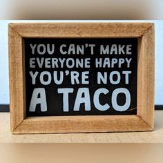 a sign that says you can't make everyone happy you're not a taco