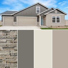 the exterior of a house with gray siding and stone walls