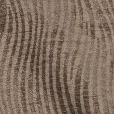 an area rug with wavy lines on it