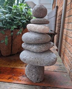 a stack of rocks sitting on top of a wooden table