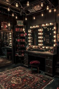 a dressing room with lots of lights hanging from the ceiling and a rug on the floor