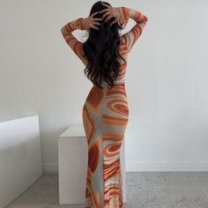 Features: The Patricia V Neck Print Maxi Dress is a perfect mix of style and comfort. Featuring a V neckline, long sleeves, and a body-hugging fit, this dress creates an elegant silhouette that is sure to get you noticed. Crafted with a stylish printed design, this dress is ideal for special occasions or any day-to-day look. Orange Fitted Long Sleeve Maxi Dress, Orange Long Sleeve Midi Dress, Fitted Orange Long Sleeve Maxi Dress, Fitted Orange Maxi Dress For Fall, Fitted Long Sleeve Maxi Dress For Fall, Elegant Orange Long Sleeve Maxi Dress, Elegant Long Sleeve Orange Maxi Dress, Chic Orange Long Sleeve Maxi Dress, Spring Long Sleeve Fitted Bodycon Dress