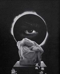 a black and white photo of a statue with an eye in the background that appears to be half - moon