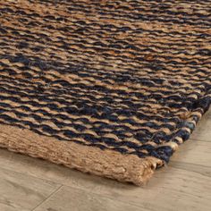 a blue and brown rug on the floor