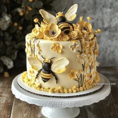 there is a cake decorated with bees and flowers