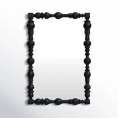 a black frame made out of wooden beads