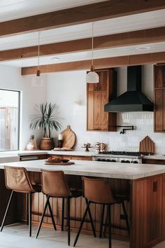 the kitchen is clean and ready to be used for cooking or eating, as well as seating