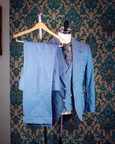 "ABOUT THIS STYLE: This style is inspired by the suits of the late 1920s and early 1930s. The sort of suit that you would throw on to go to the racetrack or a summer party. The jacket features a low lapel gorge, full lapels, and pleated patch pockets that are completely stitched by hand with handmade bartacks in the pocket corners. In our own era, this is the perfect suit for a summer wedding, whether you are the one getting married or are attending as a guest. THE MUSLIN FITTING PROCESS: The pr Spring Vintage Tailored Suits, Fitted Summer Pantsuit With Suit Collar, Summer Fitted Pantsuit With Suit Collar, Spring Semi-formal Pinstripe Suits, Fitted Pinstripe Suit With Welt Pockets, Fitted Pinstripe Suits With Welt Pockets, Fitted Pinstripe Single Breasted Suit, Fitted Pinstripe Blazer For Spring, Spring Fitted Pinstripe Blazer