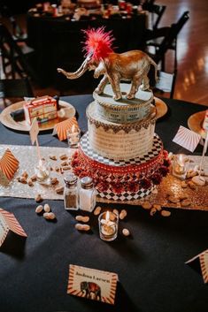 an elaborately decorated cake with a lion on top