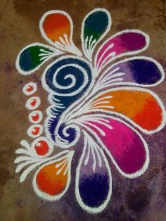 the colorful flower is drawn on the ground with white paint and black dots around it