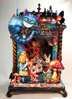 there is a miniature clock with an image of alice and the wonderlands on it