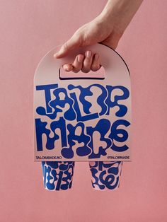 a person holding up a skateboard with the words hip hops printed on it