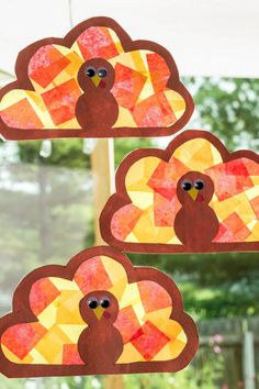 paper plate turkeys hanging from a window