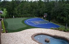 an outdoor basketball court is shown in this view from the house's deck area