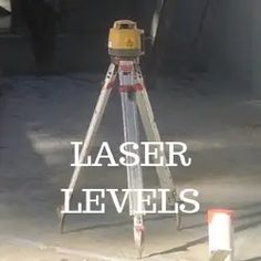 a tripod with the words laser levells on it in front of an image of a construction site