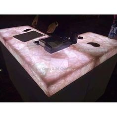 a counter top that has some kind of electronic device on it in the night time